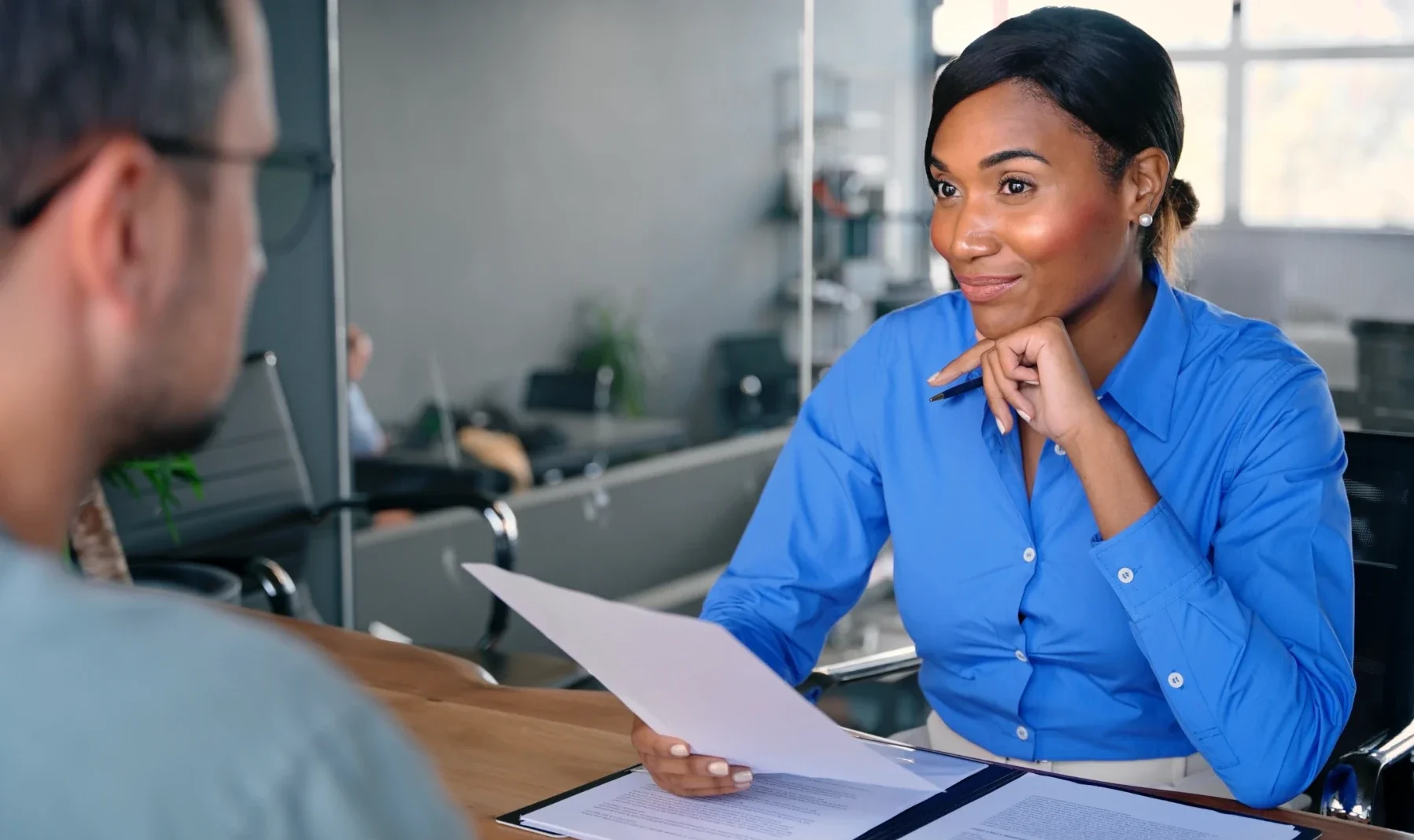 woman at desk with client